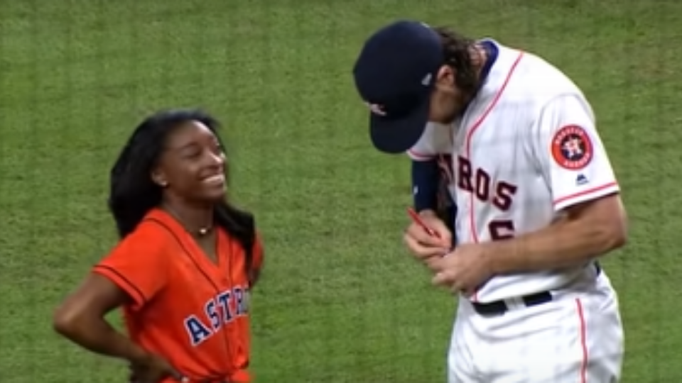 simone biles throws first pitch