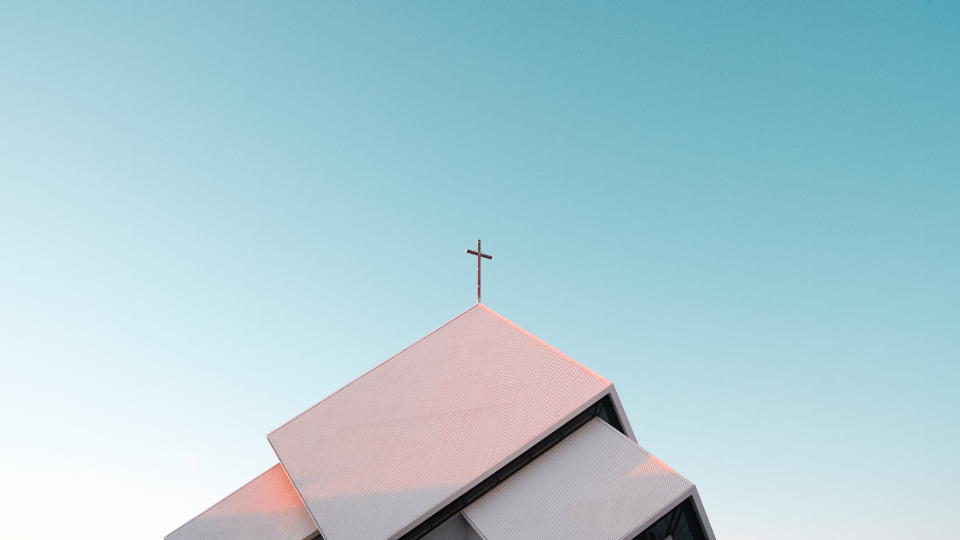 Blue sky behind a church's steeple