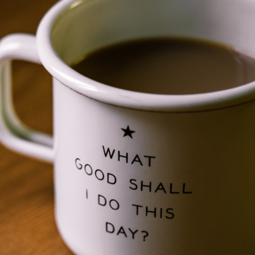 white coffee mug with the words "What Good Shall I Do This Day?" written on it