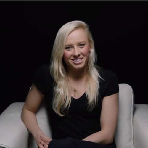 Jessica Long sitting in a white chair in front of black background for I Am Second video